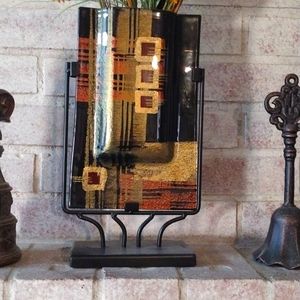 Glass vase w/metal stand.  It measures 14"x8".  Gold, copper, green and blk.